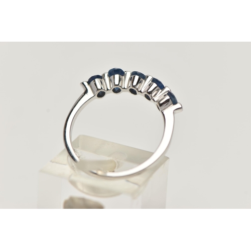 11 - A WHITE METAL SAPPHIRE AND DIAMOND HALF ETERNITY RING, designed with a row of five oval cut blue sap... 