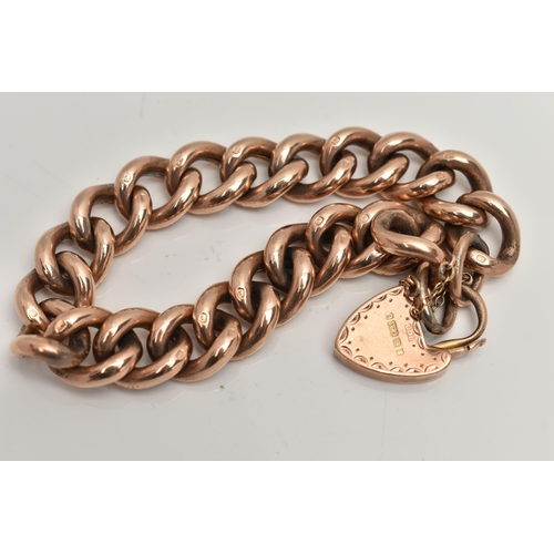 140 - A 9CT ROSE GOLD CURB LINK BRACELET WITH PADLOCK CLASP, alternating between textured and polished hol... 