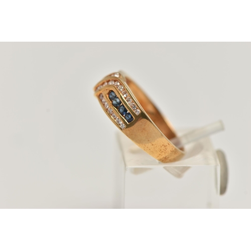 149 - AN 18CT GOLD SAPPHIRE AND DIAMOND HALF ETERNITY RING, designed with a central row of small circular ... 