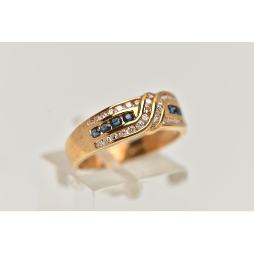 149 - AN 18CT GOLD SAPPHIRE AND DIAMOND HALF ETERNITY RING, designed with a central row of small circular ... 