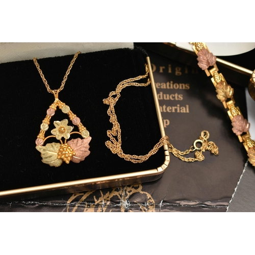 150 - A 'LANDSTROMS' 9CT GOLD SUITE OF JEWELLERY, to include an open work pendant necklace of rose and yel... 