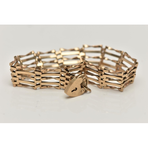 158 - A 9CT GOLD GATE BRACELET, a yellow gold five bar gate bracelet fitted with a heart padlock clasp and... 