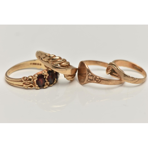 160 - THREE 9CT GOLD RINGS AND A YELLOW METAL RING, the first a yellow gold ring set with five oval cut ga... 