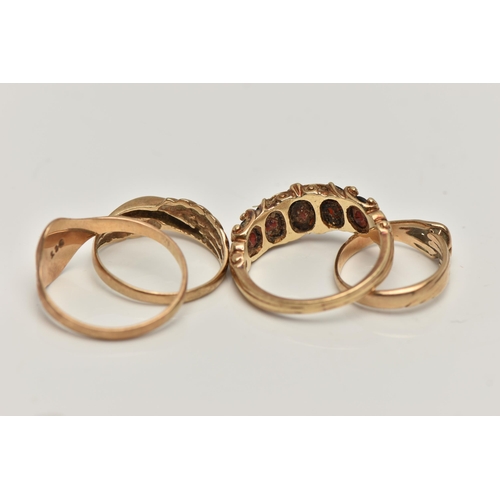 160 - THREE 9CT GOLD RINGS AND A YELLOW METAL RING, the first a yellow gold ring set with five oval cut ga... 