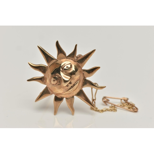 165 - A 9CT GOLD SUN BROOCH, sun with face, fitted with a brooch pin and safety clasp, with additional saf... 