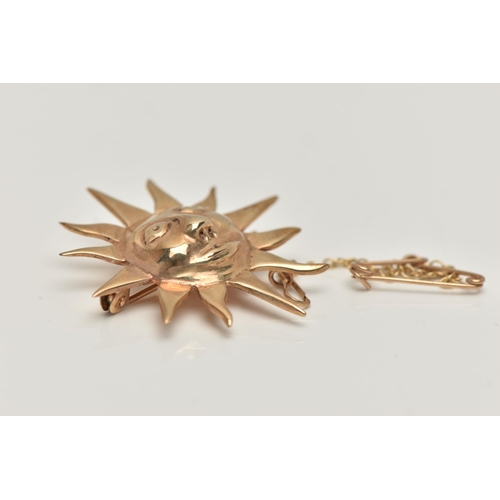 165 - A 9CT GOLD SUN BROOCH, sun with face, fitted with a brooch pin and safety clasp, with additional saf... 