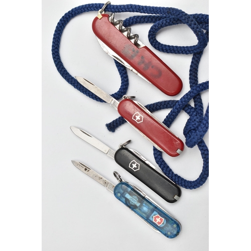 184 - FOUR SWISS ARMY KNIVES, three 'Victorinox' small Swiss army knives together with a larger 'Victorino... 