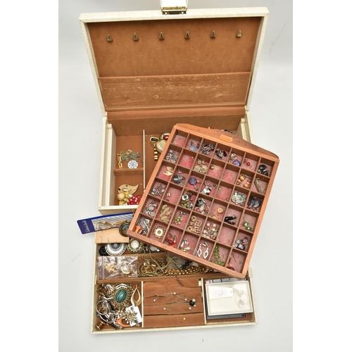 189 - A JEWELLERY BOX WITH CONTENTS AND A WOODEN TRAY OF EARRINGS, the cream jewellery box containing asso... 