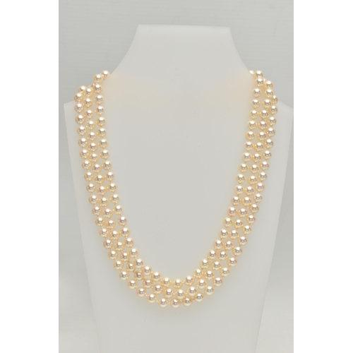 2 - A CULTURED PEARL NECKLACE, designed with three strands of individually knotted cream pearls with a p... 