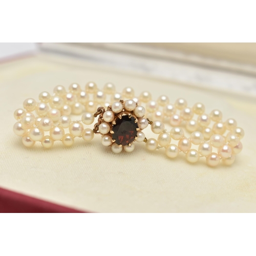 26 - A CULTURED PEARL CHOKER AND BRACELET, designed as a row of three cultured cream pearls with a pink h... 