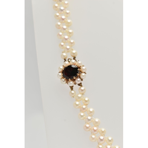 26 - A CULTURED PEARL CHOKER AND BRACELET, designed as a row of three cultured cream pearls with a pink h... 