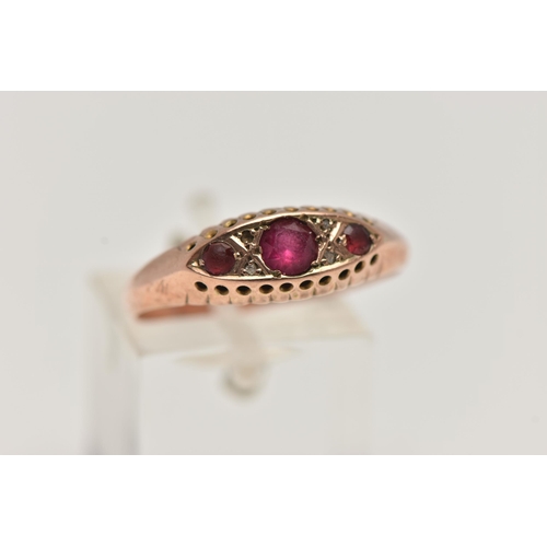 30 - AN EARLY 20TH CENTURY, 9CT ROSE GOLD RUBY AND DIAMOND BOAT RING, set with three circular cut rubies ... 