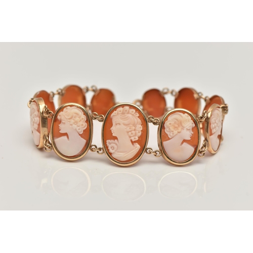 32 - A 9CT GOLD, CAMEO BRACELET, designed as a series of eleven oval carved shell cameos, each depicting ... 