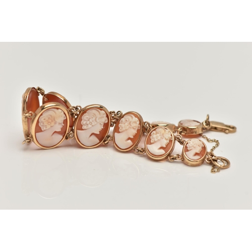 32 - A 9CT GOLD, CAMEO BRACELET, designed as a series of eleven oval carved shell cameos, each depicting ... 