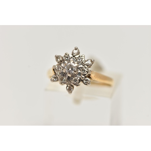 33 - AN 18CT GOLD DIAMOND CLUSTER RING, flower shape cluster ring set with a central round brilliant cut ... 