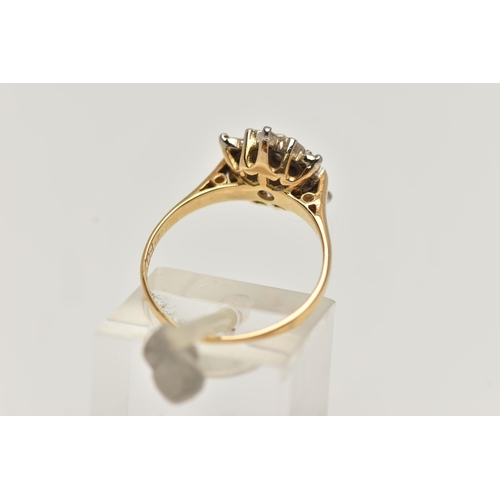 33 - AN 18CT GOLD DIAMOND CLUSTER RING, flower shape cluster ring set with a central round brilliant cut ... 