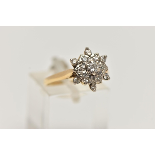 33 - AN 18CT GOLD DIAMOND CLUSTER RING, flower shape cluster ring set with a central round brilliant cut ... 