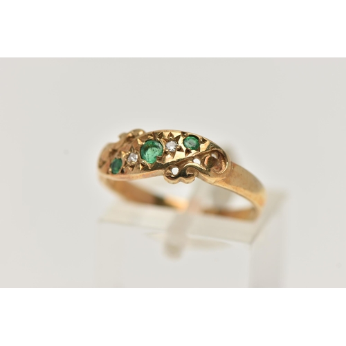 34 - A 9CT GOLD EMERALD AND DIAMOND RING, set with three circular cut emeralds, interspaced with two star... 