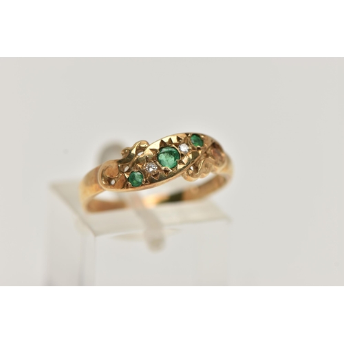 34 - A 9CT GOLD EMERALD AND DIAMOND RING, set with three circular cut emeralds, interspaced with two star... 