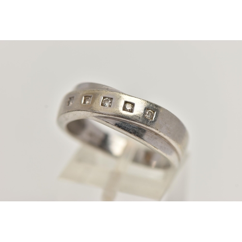 35 - A 9CT WHITE GOLD DIAMOND RING, crossed band design set with a row of five small round brilliant cut ... 