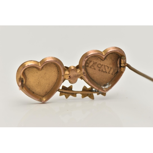 36 - A YELLOW METAL SWEETHEART BROOCH, designed as two hearts with a bow and ivy leaf detail, inscribed '... 