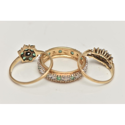 37 - THREE GEM SET RINGS, the first a full eternity band set with emeralds and small single cut diamonds,... 