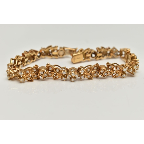 4 - AN 18CT GOLD DIAMOND SET BRACELET, articulated floral bracelet set with round brilliant cut diamonds... 