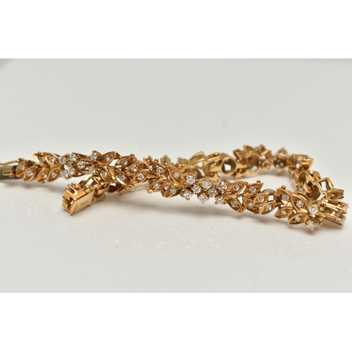 4 - AN 18CT GOLD DIAMOND SET BRACELET, articulated floral bracelet set with round brilliant cut diamonds... 