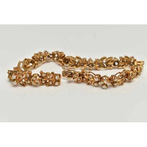 4 - AN 18CT GOLD DIAMOND SET BRACELET, articulated floral bracelet set with round brilliant cut diamonds... 