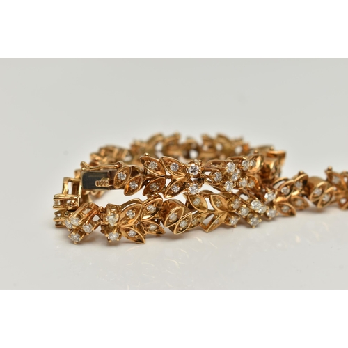 4 - AN 18CT GOLD DIAMOND SET BRACELET, articulated floral bracelet set with round brilliant cut diamonds... 