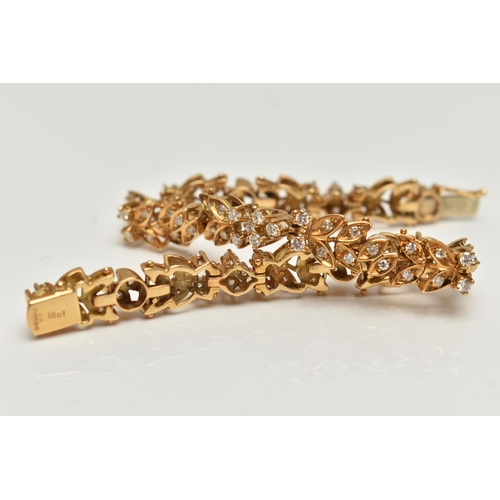 4 - AN 18CT GOLD DIAMOND SET BRACELET, articulated floral bracelet set with round brilliant cut diamonds... 