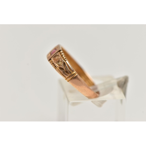 41 - A LATE VICTORIAN 15CT GOLD RING, designed with a star set circular cut ruby, flanked with discoloure... 