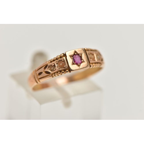 41 - A LATE VICTORIAN 15CT GOLD RING, designed with a star set circular cut ruby, flanked with discoloure... 