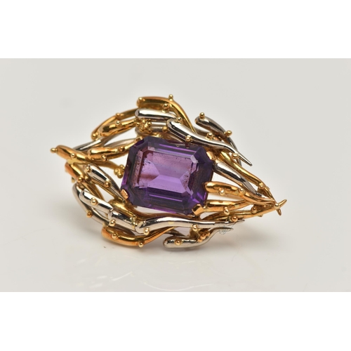 6 - AN 18CT BI-COLOUR AMETHYST BROOCH, centring on a rectangular cut amethyst with cut off corners, four... 