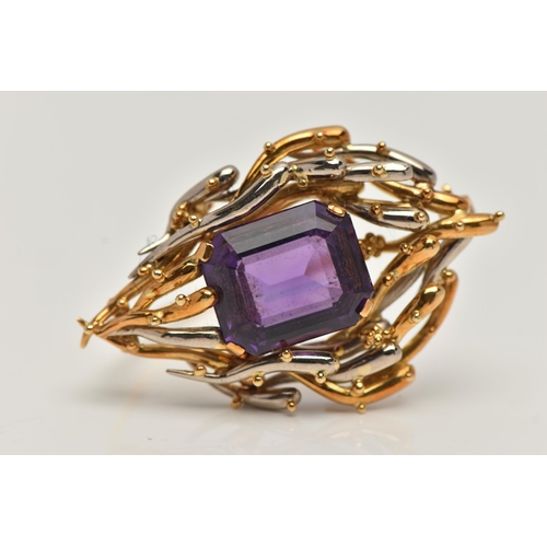 6 - AN 18CT BI-COLOUR AMETHYST BROOCH, centring on a rectangular cut amethyst with cut off corners, four... 