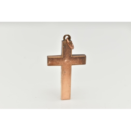 102 - A YELLOW METAL CROSS PENDANT, polished cross, stamped 15ct, fitted with a jump ring for suspension, ... 