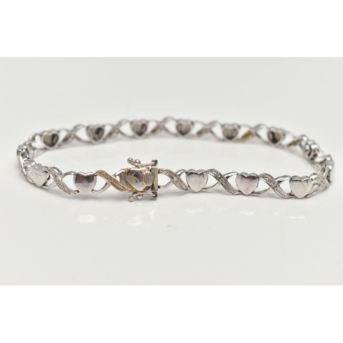 127 - A 9CT WHITE GOLD BRACELET, designed as a series of polished hearts and single cut diamond set cross ... 