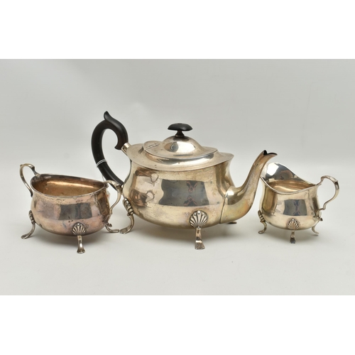 214 - AN EARLY 20TH CENTURY THREE PIECE SILVER TEA SERVICE SET, comprising of a polished teapot, raised on... 