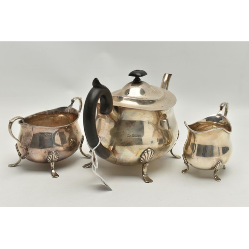 214 - AN EARLY 20TH CENTURY THREE PIECE SILVER TEA SERVICE SET, comprising of a polished teapot, raised on... 