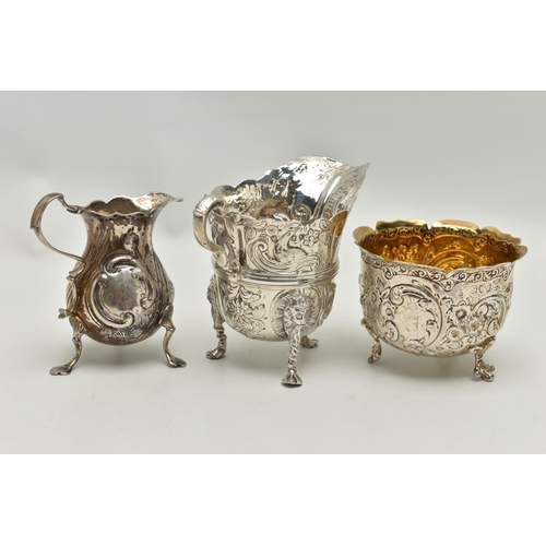 215 - THREE PIECES OF SILVER, to include a George II creamer, embossed floral pattern with engraved monogr... 