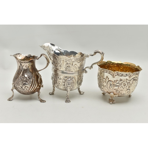 215 - THREE PIECES OF SILVER, to include a George II creamer, embossed floral pattern with engraved monogr... 