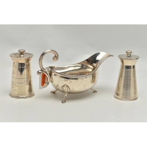 219 - AN ELIZABETH II SILVER SAUCE BOAT AND TWO ELIZABETH II SILVER MILK CHURN SHAPED PEPPERMILLS, the sau... 