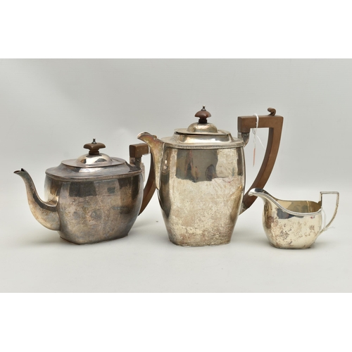 227 - A THREE PIECE GEORGE V SILVER TEA SET, of oblong baluster form, comprising a teapot, hot water jug, ... 