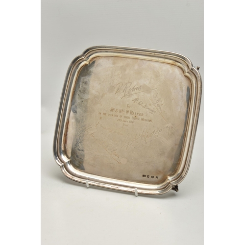 232 - AN EARLY 20TH CENTURY SILVER WAITER, of a polished square form, personal engraving to the centre rea... 