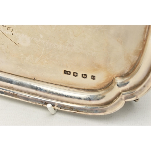 232 - AN EARLY 20TH CENTURY SILVER WAITER, of a polished square form, personal engraving to the centre rea... 