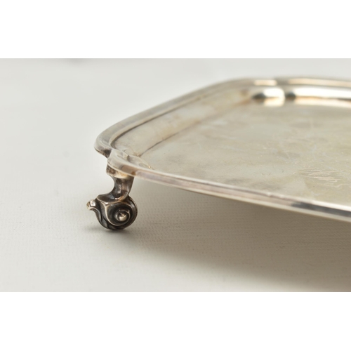 232 - AN EARLY 20TH CENTURY SILVER WAITER, of a polished square form, personal engraving to the centre rea... 