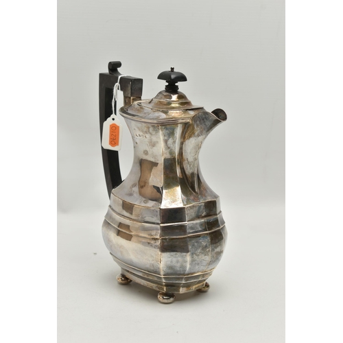 233 - A GEORGE V SILVER COFFEE POT, polished faceted form, fitted with an ebonised handle and finial, rais... 