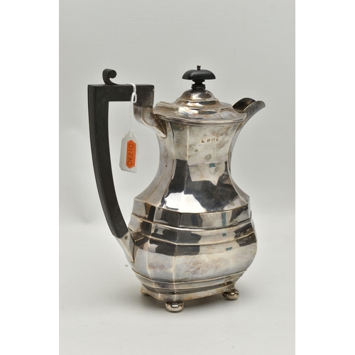 233 - A GEORGE V SILVER COFFEE POT, polished faceted form, fitted with an ebonised handle and finial, rais... 