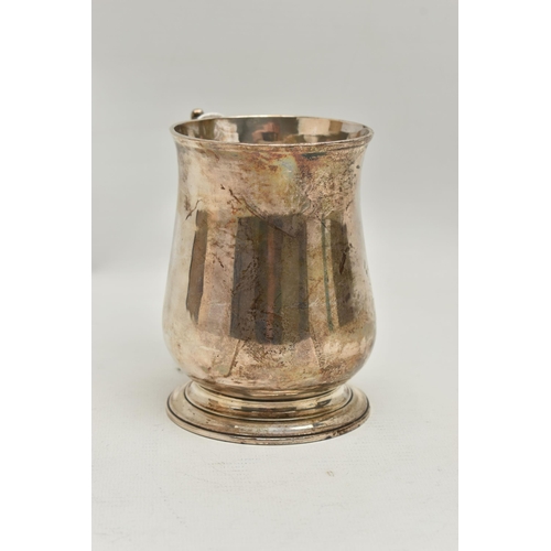 235 - A GEORGE III SILVER TANKARD, polished bell shape tankard, fitted with a scrolling handle, hallmarked... 