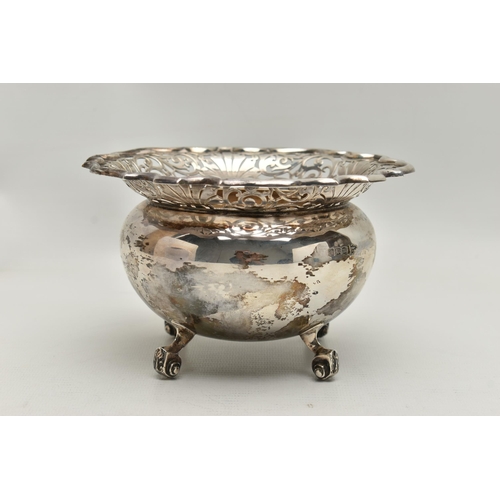 236 - A SILVER BONBON DISH, deep round bowl with a worn gilt interior, wavy open work rim, raised on four ... 